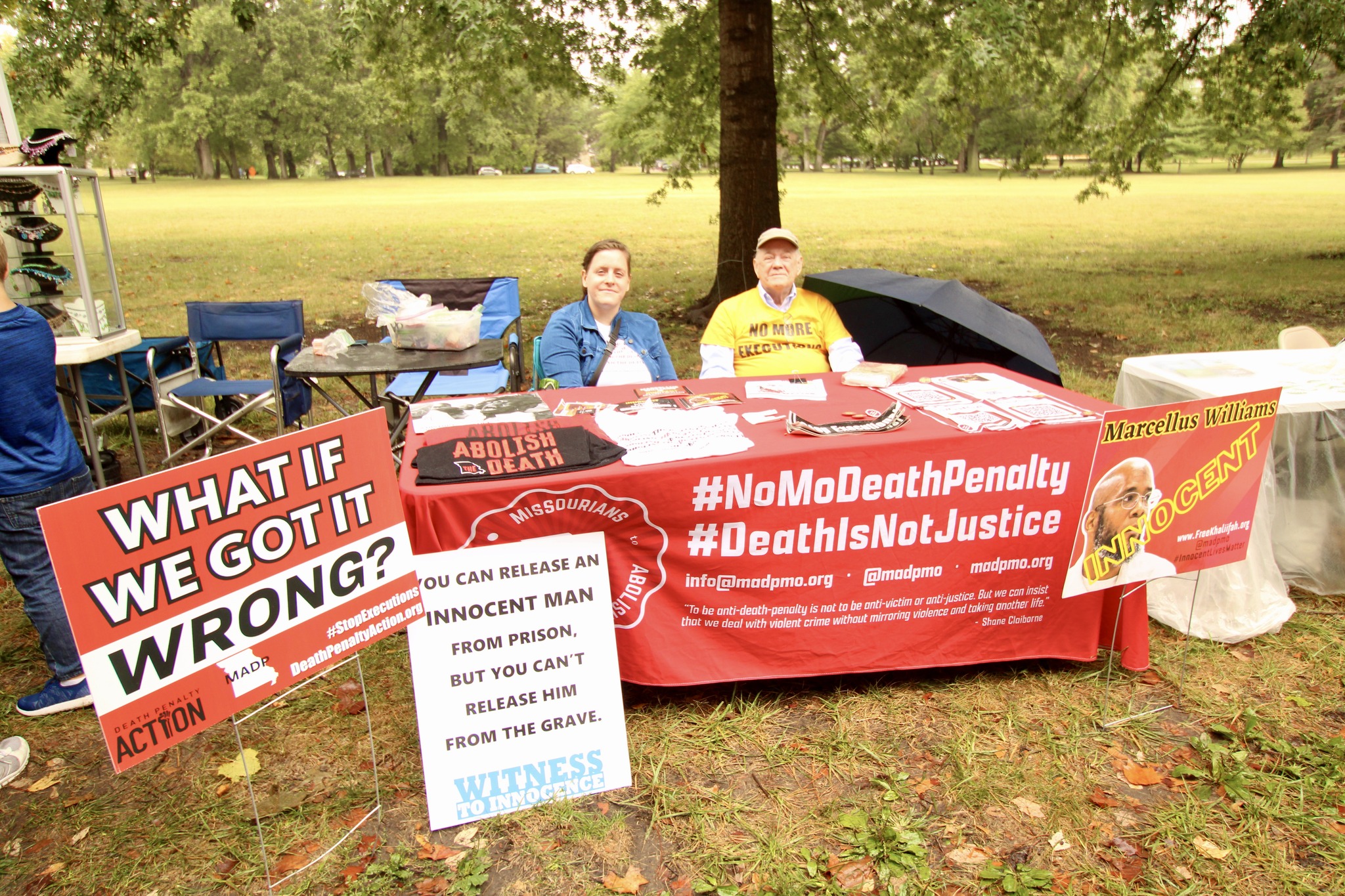 anti-death penalty table, signs, activists