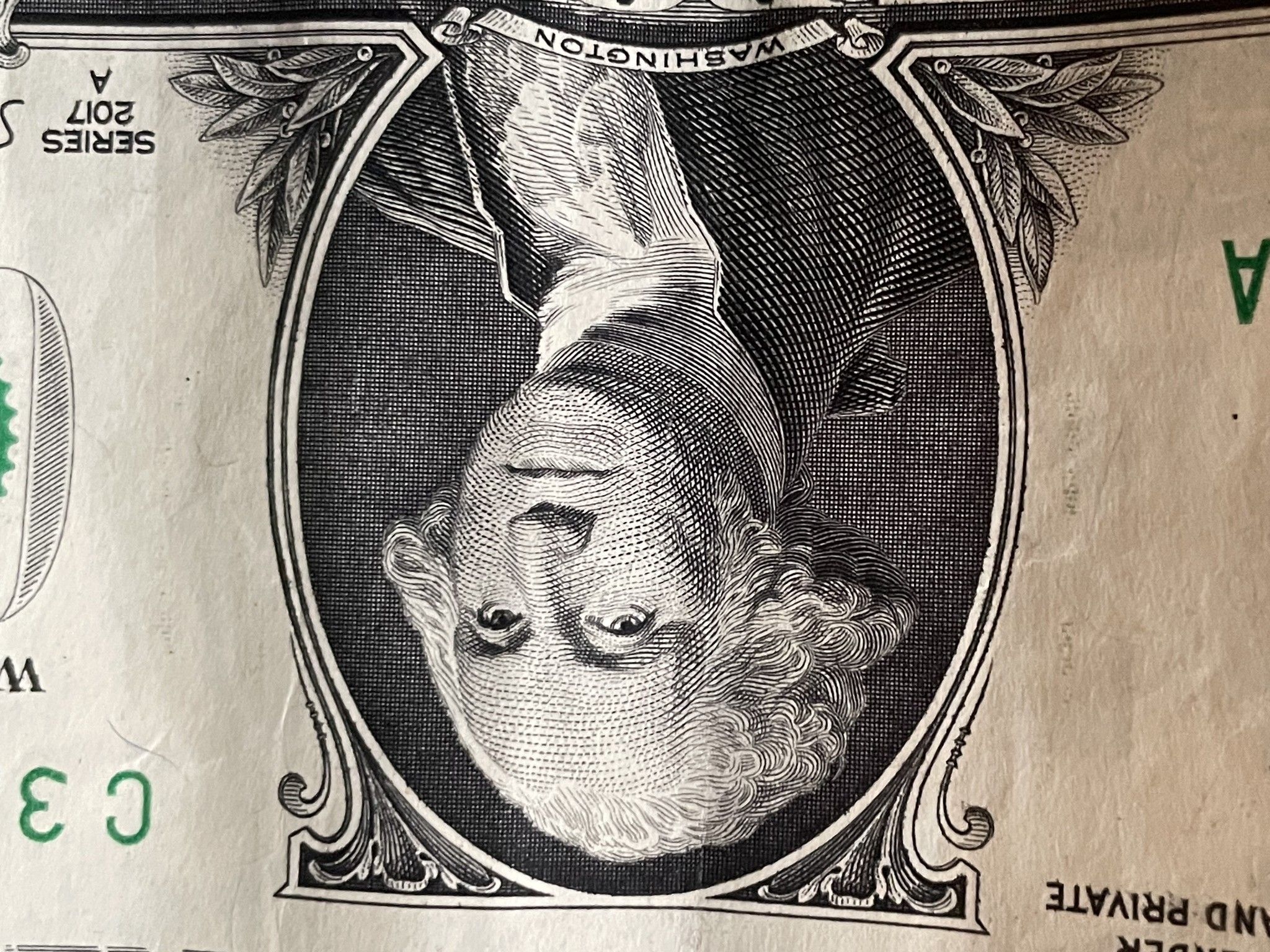 Upside down Washington $1 bill